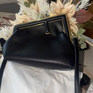 Chic Black Crossbody Bag with Gold Accents